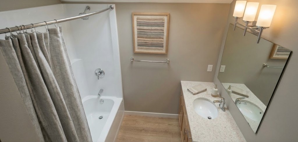 Apartment bathroom with tub and vanity